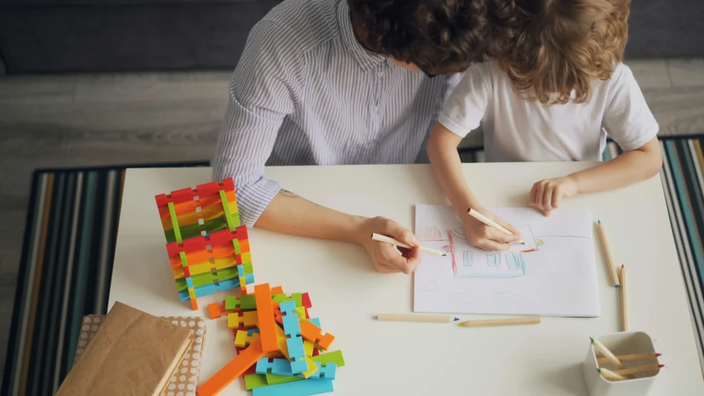 young boy using building sticks